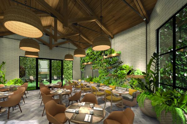 A restaurant interior with plants, wooden ceiling, and round tables set for dining.